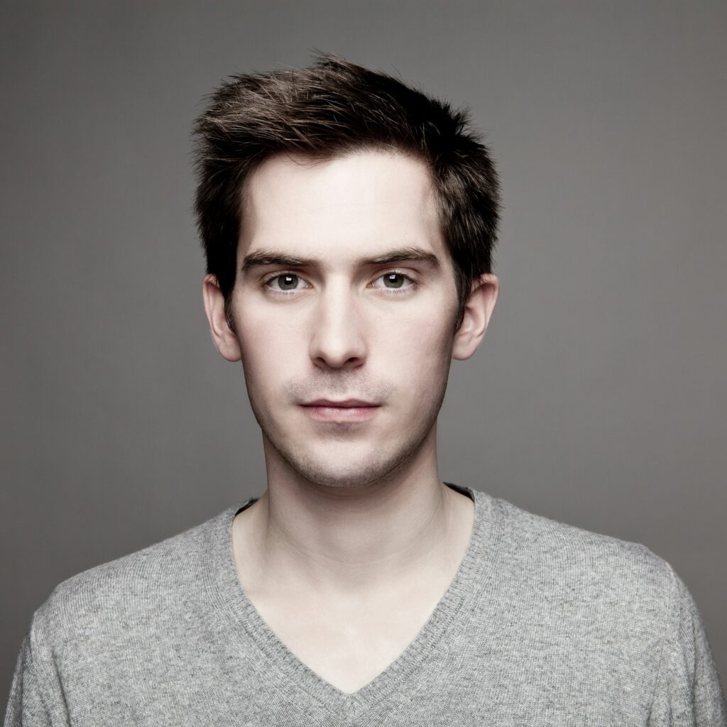 Portrait of serious looking young man, close-up